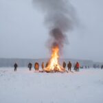 bonfire-in-scandinavian-field-snow-and-people-aro-upscaled